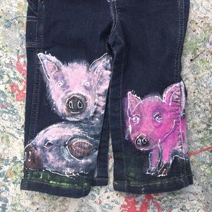 SOLD.    Hand painted baby wrangler overalls